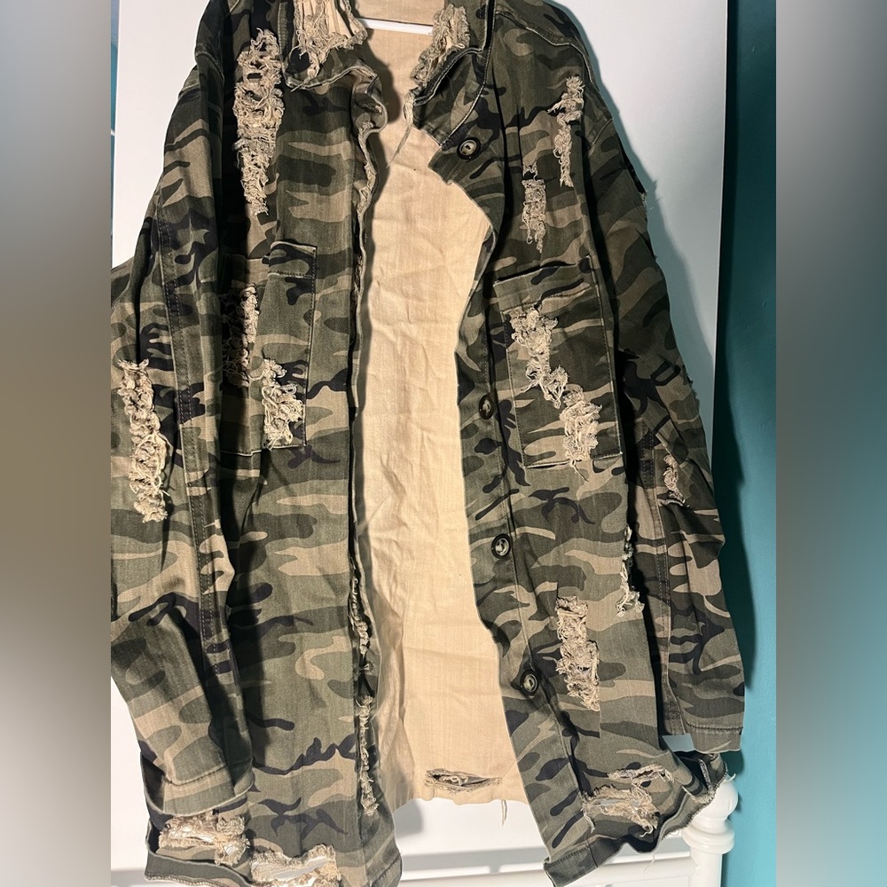 Hey! I am selling this Fashion Nova camo long jacket. Size Medium.